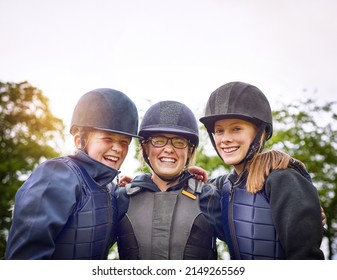 An Equestrian Team Is More Like Family. Portrait Of A Group Of Young Friends Going Horseback Riding Outside.