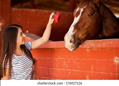 Equine Therapy Patient Interacting And Having Fun With A Horse At A Ranch