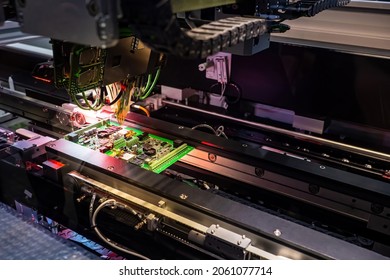 Equipment for assembly of printed circuit boards. Creation of PCB on CNC machine. Laser printing on computer board. Robot fixes transistors on printed circuit board. Manufacturing of microchips.