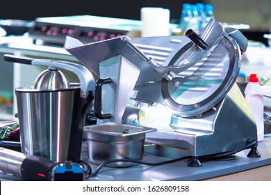 Equipment For Cafes And Restaurants. Stainless Steel Kitchen Appliances. Slicer And Industrial Food Processor On The Table. Chef's Workplace. Cooking In The Cafe.