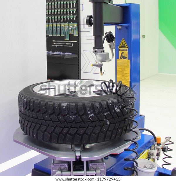 Equipment for car service - new tire machine for\
repair (Assembly and disassembly) of automobile wheels with witner\
tire on mounting\
table