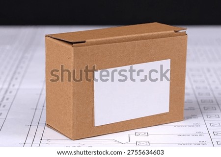 equipment in cardboard packaging on an electronic digram during the assembly of the electrical control panel.