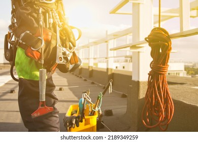 Equipment Of Industrial Mountaineer Laborer On Roof Of Building During Industry High-rise Work. Climbing Equipments Before Starting Job. Rope Laborer Access. Concept Of Urban Works. Copy Space