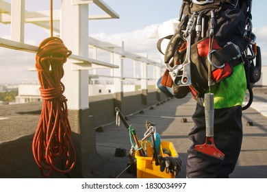 Equipment Of Industrial Mountaineering Worker On Roof Of Building During Industrial High-rise Work. Climbing Equipments Before Starting Job. Rope Laborer Access. Concept Of Urban Works. Copy Space