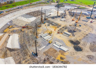 Equipment for installing piles in ground, heavy machines for driving pillars work in laying the foundation building. Construction aerial view height