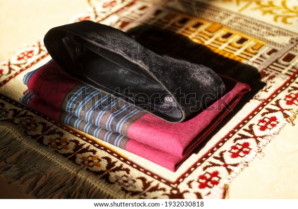 equipment for Islamic religious worship. prayer mat,\
sarong, and cap