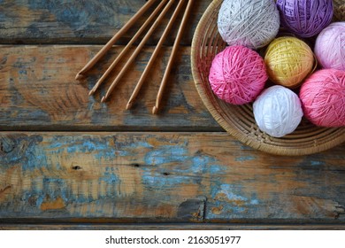 The equipment for knitting and crochet hook, colorful rainbow cotton yarn, ball of threads, wool. Handmade crocheting crafts. DIY concept. Copy space - Powered by Shutterstock