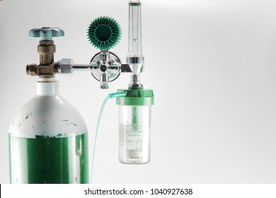 Equipment Medical Oxygen Tank And Cylinder Regulator Gauge.Control Pressure Oxygen Gas For Care A Patient Respiratory Disease And Emergency CPR At Hospital, Close Up Focus On Black Background.