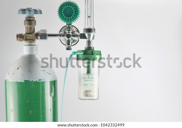Equipment medical Oxygen tank and Cylinder\
Regulator gauge.Control pressure oxygen gas for care a patient\
respiratory disease and emergency CPR at Hospital, Close up focus\
on white background.