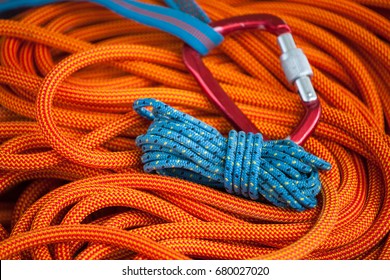 Equipment For Mountaineering Lies On An Orange Rope