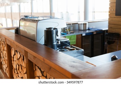 equipment, object and technology concept - close up of coffee machine at bar or restaurant counter