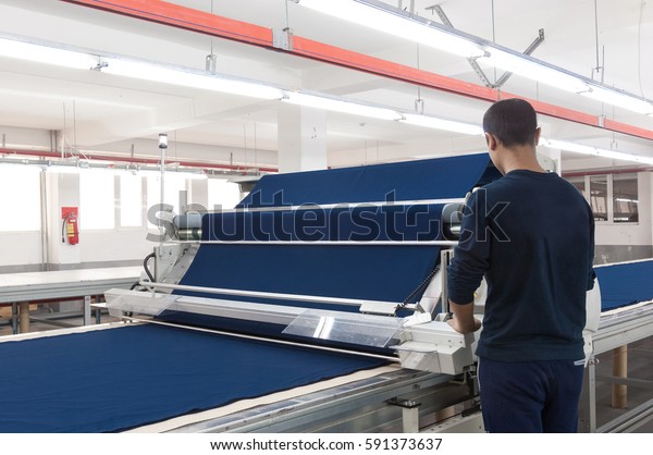 equipment for the preparation of cloth at a\
garment factory