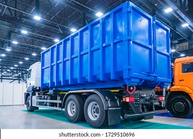 Equipment for public utilities. Truck for the removal of large-sized garbage. Municipal economy. The trash bin is mounted on the truck. Removal of construction debris.