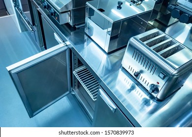 Equipment For Restaurants. Kitchen Is On The Food Front. Toaster. Deep-fried Steel Kitchen Cabinet. Open Cupboard In The Restaurant Kitchen. Equipment For Horeca. Catering Enterprise. Catering