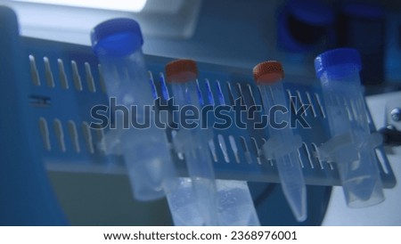 Equipment with rotating flasks. Stock footage. Rotating flasks with tests in laboratory. Chemical laboratory with rotating analyses in flasks