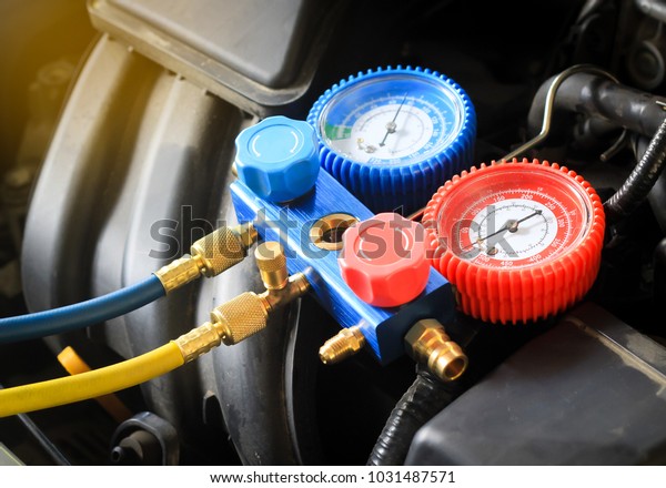 Equipment for service car air conditioner,\
close up monitoring tools car air of car\
garage.