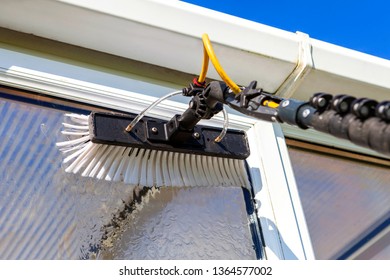 Equipment for washing and cleaning the window from the outside - Shutterstock ID 1364577002