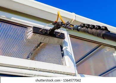 Equipment for washing and cleaning the window from the outside - Shutterstock ID 1364577062