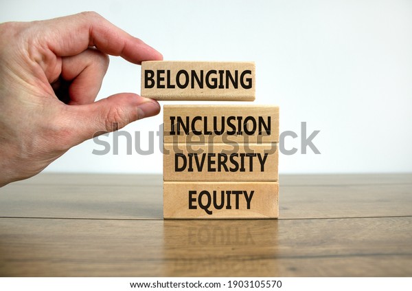 Equity, diversity, inclusion and belonging\
symbol. Wooden blocks with words \'equity, diversity, inclusion,\
belonging\' on beautiful white background. Diversity, equity,\
inclusion and belonging\
concept.