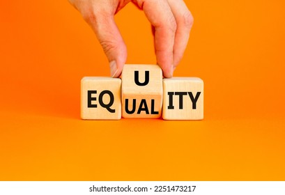 Equity or equality symbol. Concept word Equity Equality on wooden cubes. Businessman hand. Beautiful orange table orange background. Business and equity or equality concept. Copy space. - Shutterstock ID 2251473217