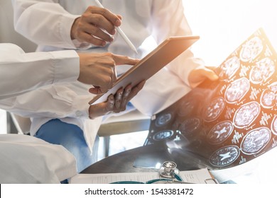 ER surgery medical team, surgical doctor teamwork, professional brain and neurological surgeon with digital tablet working in hospital clinic discussion, diagnosing on patient care operation service
