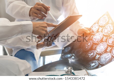 ER surgery medical team, surgical doctor teamwork, professional brain and neurological surgeon with digital tablet working in hospital clinic discussion, diagnosing on patient care operation service