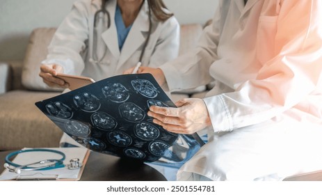 ER surgical doctor teamwork, surgery medical team, professional brain and neurological surgeon with digital tablet working in hospital clinic discussion, diagnosing on patient care operation service - Powered by Shutterstock