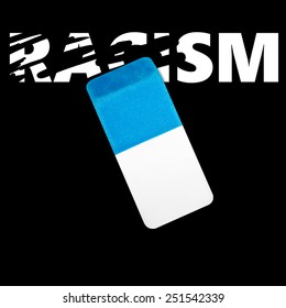 Eraser Erasing The Word RACISM On A Black Background