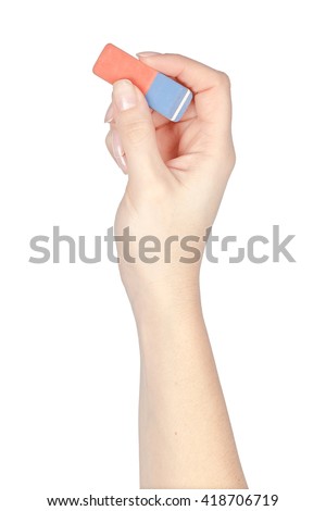 eraser tool in a hand isolated on white background. school and office tools. stationery