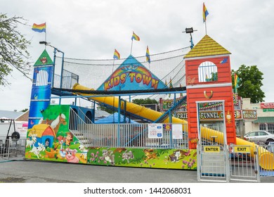 ERATH, L.A. / USA - JULY 4, 2019: The Kids Town Bounce House And Tunnel Slide, A Street Fair Ride, Located At A Carnival For Fourth Of July, Independence Day Festival In Erath, Louisiana.