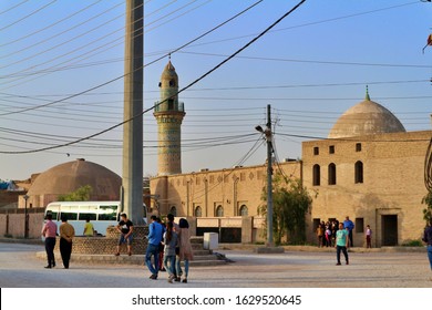 Erbil, Kurdistan / Iraq - 25 September 2019: Citadel Top Main Central Square Flag Minaret Mosque Old Turkish Bath Kurdish People Walking