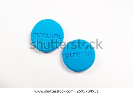 Erectile dysfunction pills on a white background with copyspace