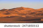 Erg Chebbi, the largest sand Dune in Morocco at sunset. Merzouga has become a popular destination for tourists because of this feature.