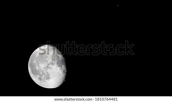 Erie, Pennsylvania - September 06, 2020: From our\
perspective on Earth, our Moon appears to pass by the planet Mars\
at a close distance. This was taken exactly at 02:16:34 AM on\
September 06, 2020.