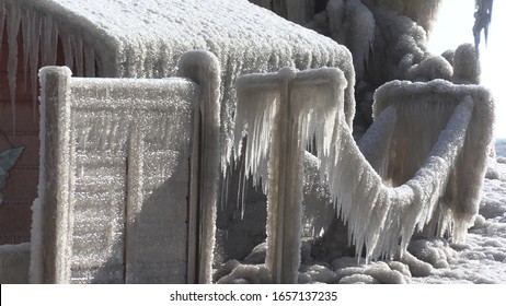 Erieau, Ontario, Canada February 2020 houses encased in thick ice after freezing spray rain and wind storm