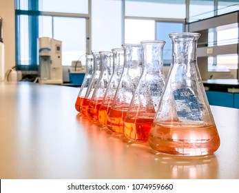 The Erlenmeyer Flask In The Line With Color Range Solvent Using For Analysis Calibration Curve Of Iron In Waste Water Sample. The Experiment In Chemistry Laboratory.