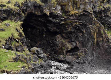 Eroded basalt column formations at Londrangar in Iceland