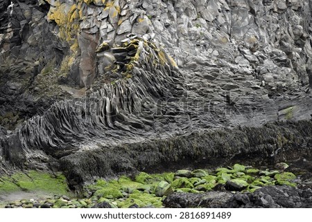 Eroded basalt column formations at Londrangar in Iceland