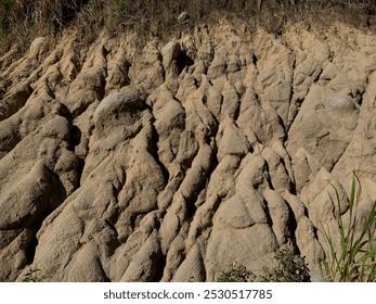 Eroded Cliffs. Closeup image of an eroded cliff face revealing the texture of the earth's surface. - Powered by Shutterstock