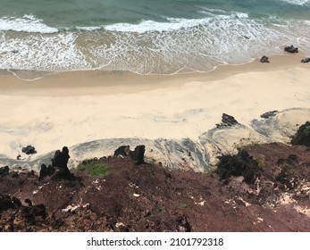 Eroded cliffs and sand on the beach