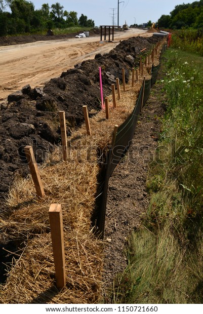 Erosion control materials to protect the\
environment during new road construction.\
