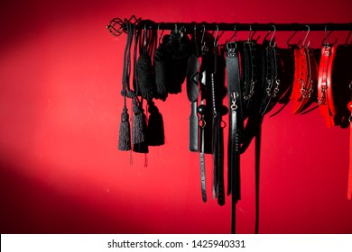 Erotic Games And Human Sexuality Concept. Kinky Sex Toys For  BDSM Fantasy Play (ball Gag, Cuffs, Rope, Flogger, Collar And Leash)