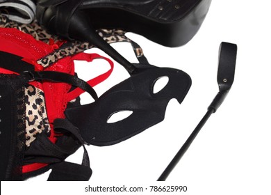 Erotic passion toys, mask, brassieres, shoes, whip mix. Fetish role playing concept.