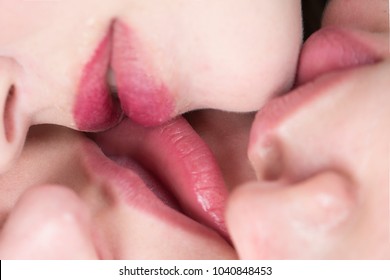 Erotica. Female lips of three women together close-up. Group kiss. Homosexual love and tenderness, tender kiss, girlfriends, women's day. Feminists and lesbians, lips closeup