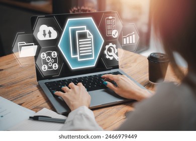 ERP, Enterprise Resource Planning concept, Businesswoman using laptop computer on desk with Enterprise, Resource and Planning icon on virtual sscreen, software system for business resources plan.