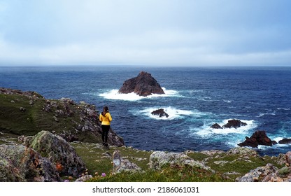 Erris Head. County Mayo, Ireland.

View of the rugged Mullet Peninsula and Broadhaven Bay. Young lady admires a the rugged North Atlantic coastline of the Wild Atlantic Way on a cold, misty day. - Shutterstock ID 2186061031