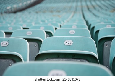 Error 404: seat not found. Rows of blue seats with numbers in a stadium