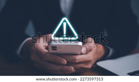 Error and maintenance alert. Businessman using computer laptop with triangle caution warning sing for notification error and maintenance concept.