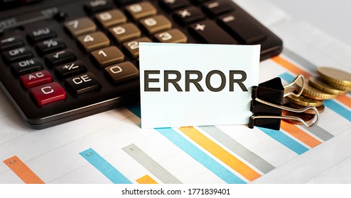 Error. Note Is Written On A White Sticker With Calculator On Chart Background .