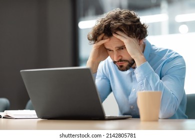 Error. Portrait Of Sad Business Man Sitting At Desk Using Pc, Grabbing Head Looking At Screen. Remote Work. Stressed Guy Suffering Job Problems, Reading Unexpected Bad Negative News, Free Copy Space